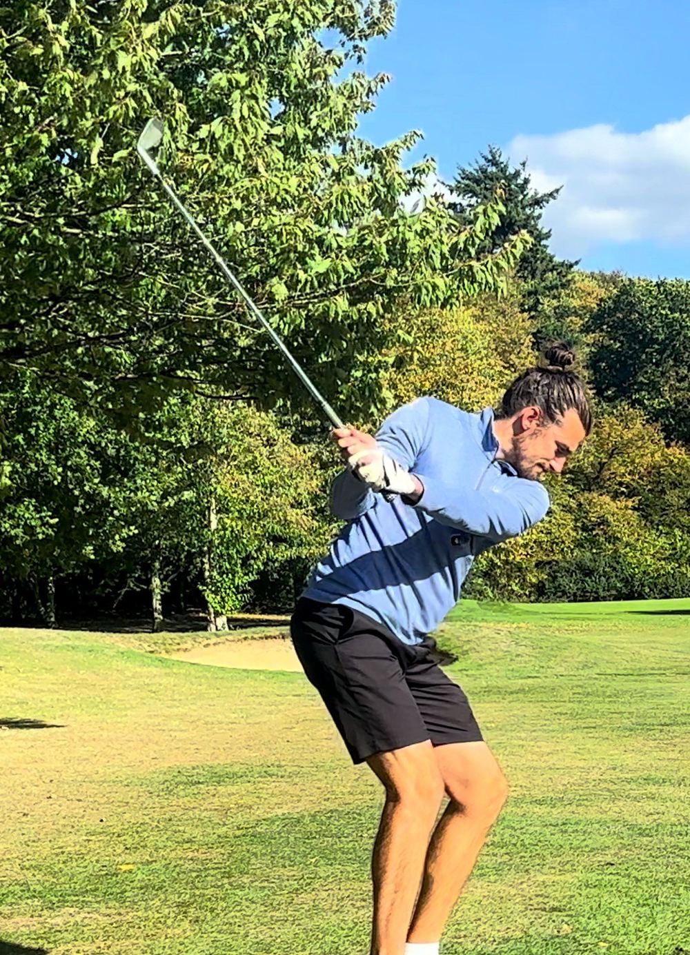 Dan at the top of his backswing on the fairway
